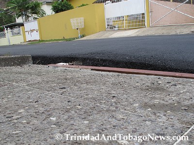 Here is a picture from the driveway that shows what the car has to now mount notwithstanding the four inches square steel that was placed into the slipper drain.