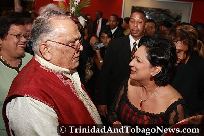 Secretary General of the Sanatan Dharma Maha Sabha, Sat Maharaj and Prime Minister Kamla Persad-Bissessar engage in a chat at the Independence Awards reception at Queen's Hall