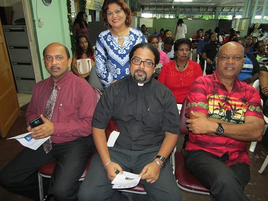 Special Guests PE Kowlessar, Rev Sieunarine and Elder Mr Charles Mahabir with School Principal, Mrs Jenny Kowlessar (Back) At the Xmas Function