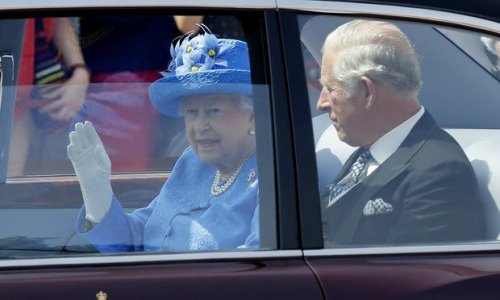 Her Majesty the Queen with Prince Charles on her way to Parliament in her Bentley