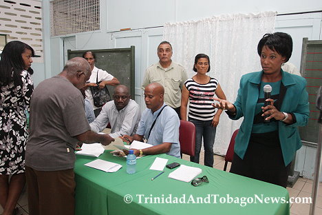 Residents chat with members of the head table while one member addresses fustrated residents