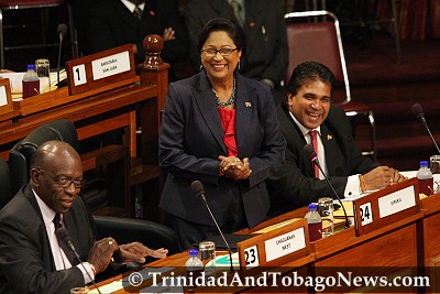 Prime Minister Kamla Persad-Bissessar, Works and Transport Minister Jack Warner and leader of government business Roodal Moonila share a laugh in Parliament - June 25, 2010