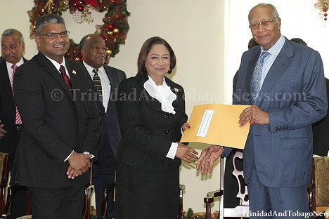 Prime Minister Kamla Persad-Bissessar receives her Senior Counsel appointment from President George Maxwell Richards