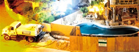 A Water and Sewerage Authority (WASA) tank truck is caught filling a pool at a private residence on Columbus Circle, Westmoorings, on Wednesday night.